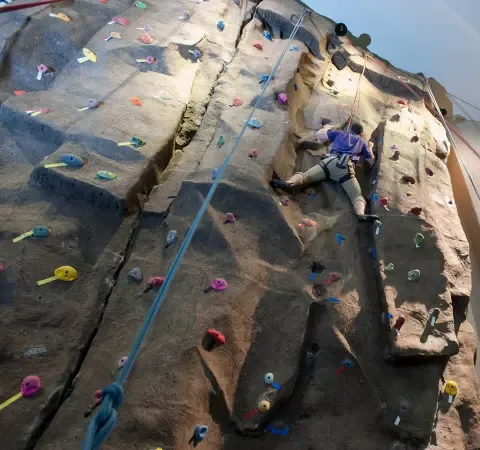 student climbing